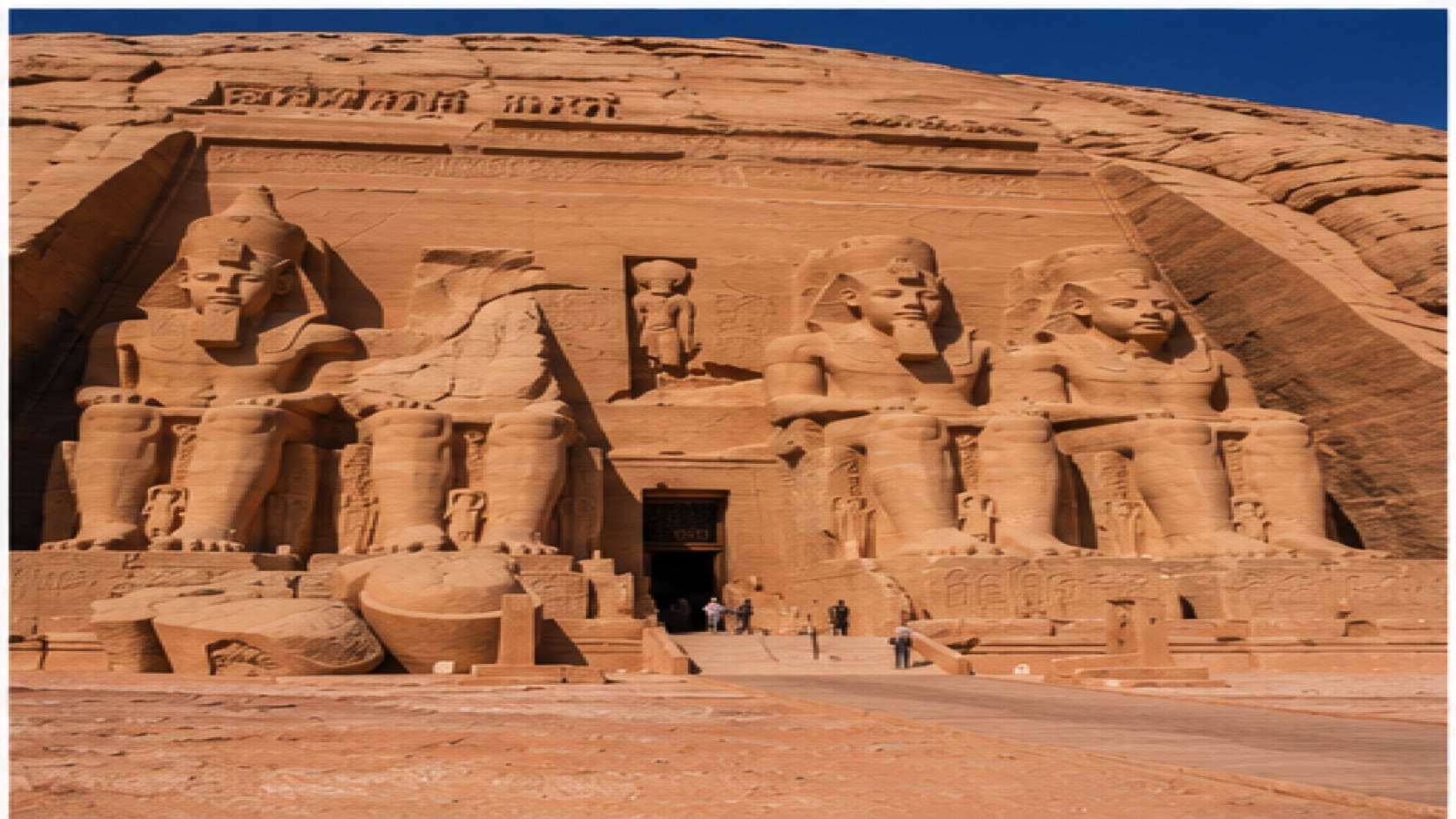 Abu Simbel temple facade with seated statues