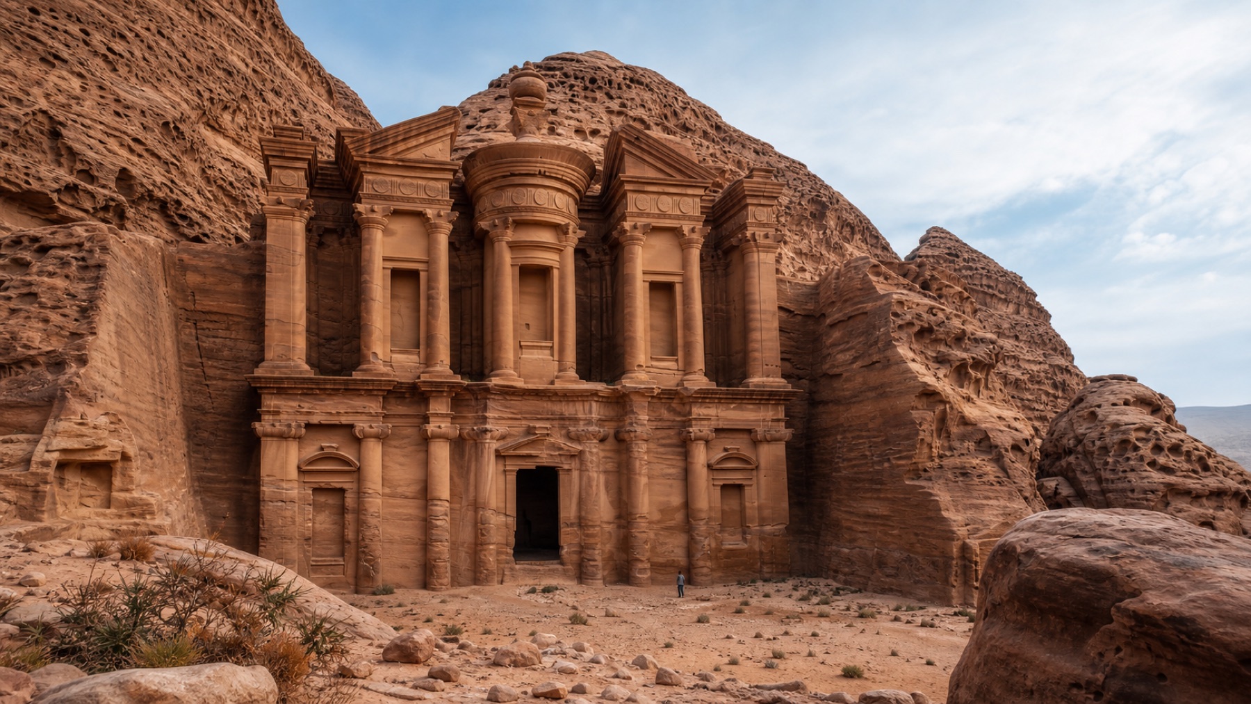The Monastery facade in Petra surrounded by rose sandstone cliffs
