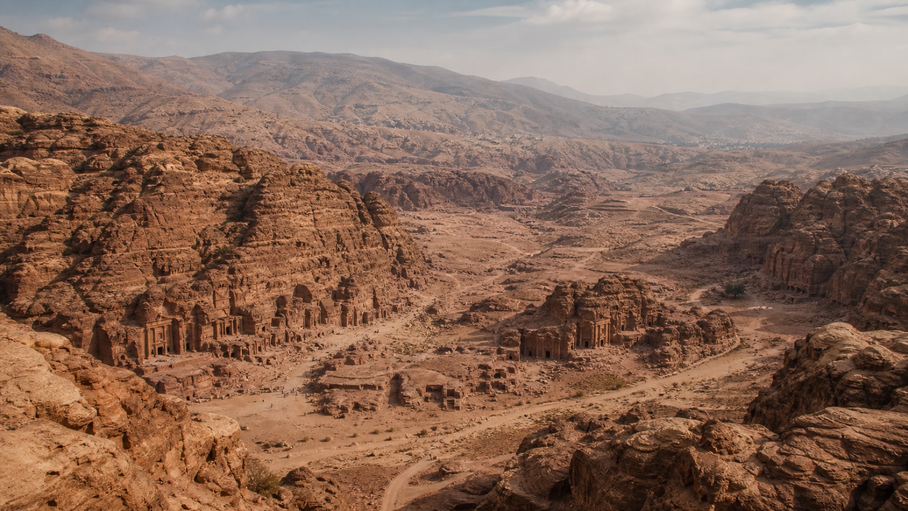 Panoramic Petra viewpoint over rugged rose sandstone valleys