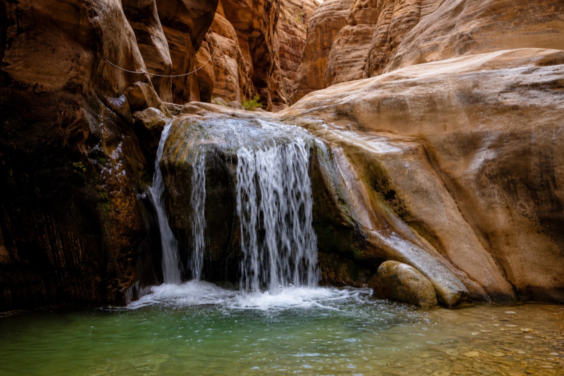 Small waterfall along the Wadi Al Mujib Siq Trail